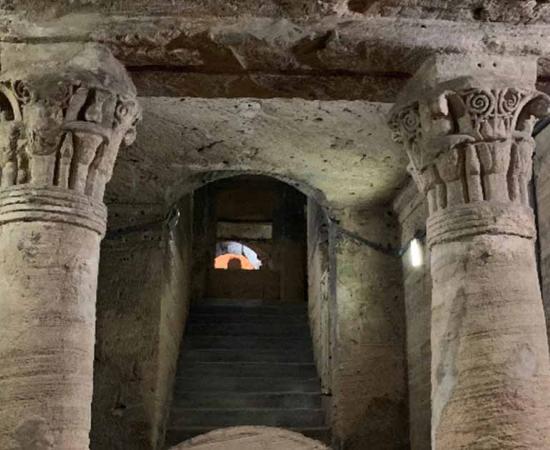 Inside the Catacomb of Kom El Shoqafa. The catacombs of Kom El Shoqafa `Mound of Shards` is a historical archaeological site located in Alexandria, Egypt, and is considered one of the Seven Wonders.  Source: mekarim/Adobe Stock