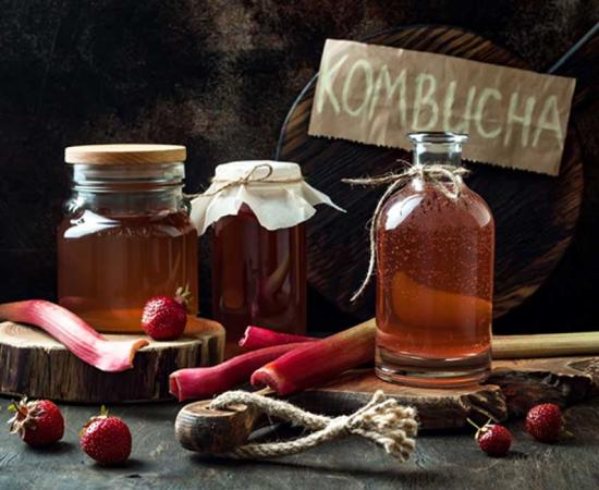 Homemade fermented raw kombucha tea with different flavorings. Source: sveta_zarzamora / Adobe.