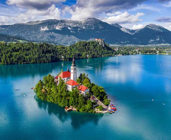 Assumption of Mary Church on Lake Bled Island, Slovenia. Source: zgphotography / Adobe Stock.