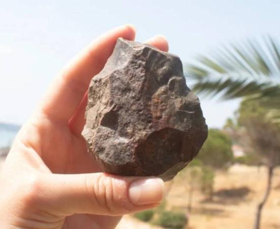 Paleolithic handaxe with broken distal end discovered during the Ayvalık survey.
