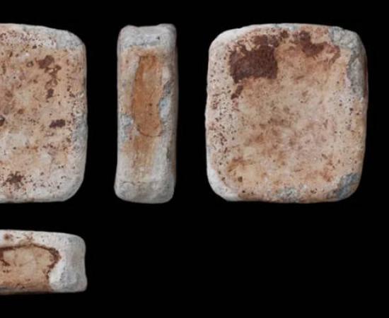 One of three lead ingots discovered with seven bronze items by a metal detectorist near Dereham, Norfolk