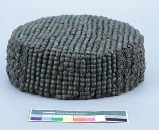 A rare 2,500-year-old woman’s leather cap decorated with small bronze plaques, discovered in a Scythian-era burial in Ukraine.
