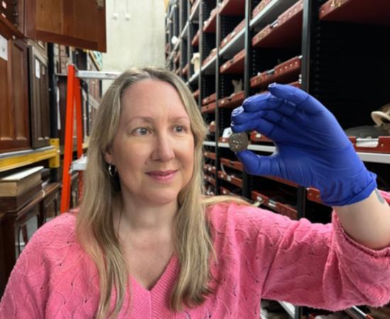 Kat Baxter, Leeds Museum and Galleries’ curator of archaeology and numismatics, shows the ancient coin.