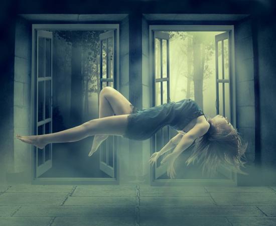 Young woman levitating