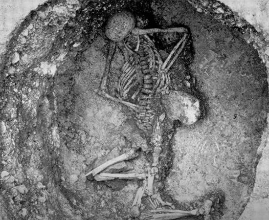 Top image: The burial at Maiden Castle Hillfort. Source: YouTube Screenshot / Smithsonian Channel.