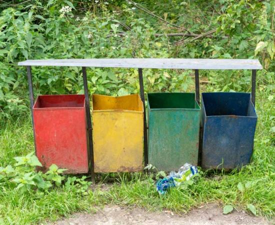 Trash cans	in a city park