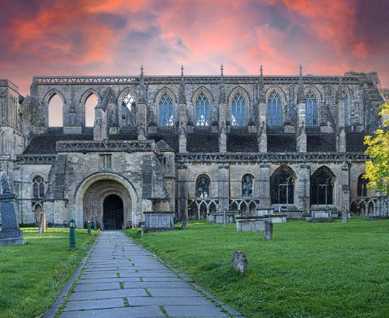 An arson attempt at Malmesbury Abbey was stopped by heroic locals. Source: Lukas Gojda / Adobe Stock