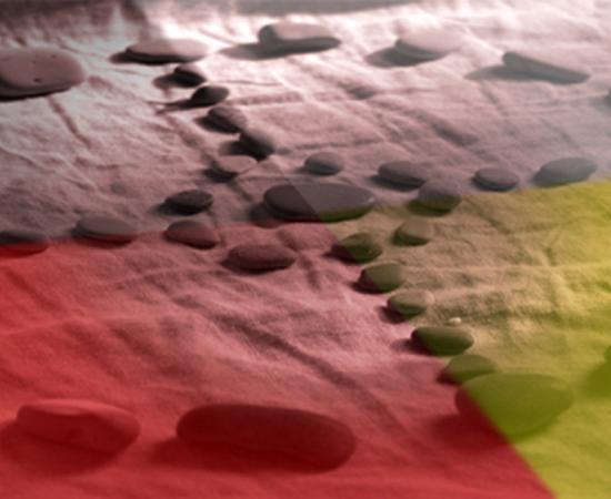 Stones arranged into a Native American medicine wheel pattern. 