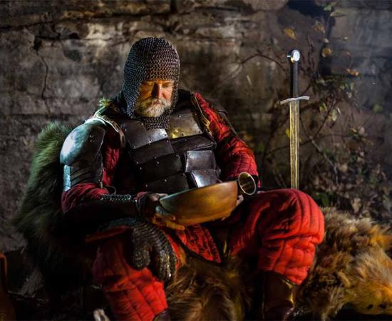 Medieval knight eating a meal. Source: diter / Adobe Stock.