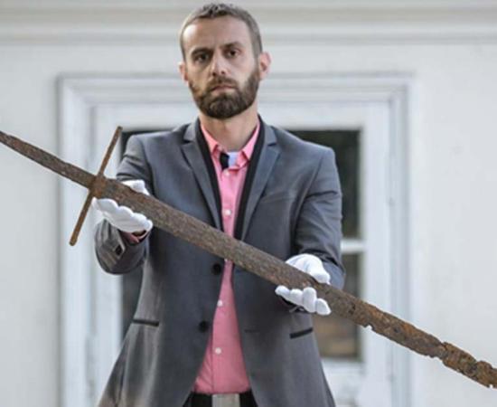 Bartłomiej Bartecki, director of the Museum in Hrubieszów presents the sword found in the Commune of Mircze. 