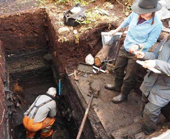 Members of the archeology team, from left to right, John Maxwell, Alisha Gauvreau, and Seonaid Duffield work on excavating the site.