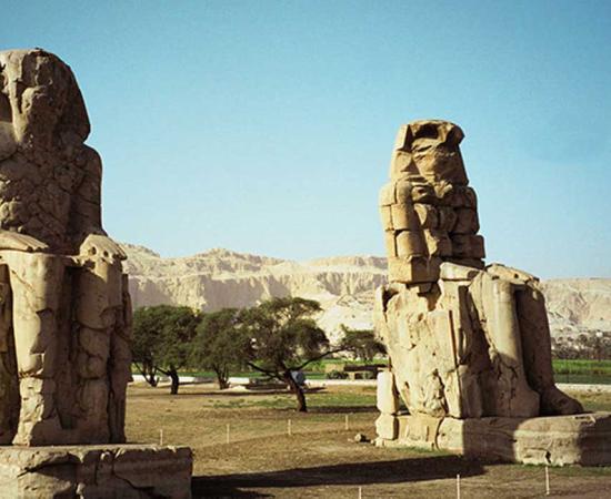 Colossi of Memnon, guarding the passage to Theban Necropolis; west-bank's section of Luxor, Egypt. 