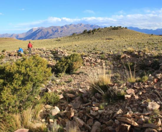Expedition members amid the stone structures at the archaeological site in the Cordillera del Tigre, Mendoza