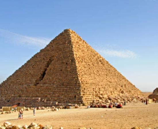 The Menkaure Pyramid at Giza with its distinctive granite casing stones visible at the base