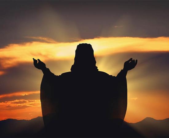 Silhouette Jesus in the sunset. Source: artphotoclub / Adobe Stock