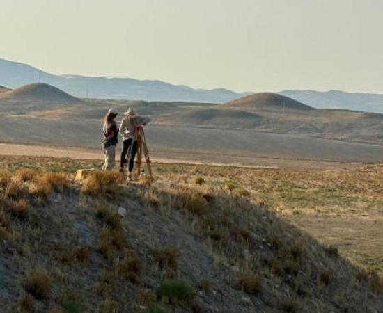The researchers studying the mounds near the citadel of Gordion, Turkey.