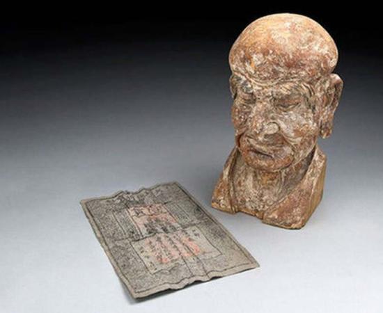 Rare Ming Dynasty Banknote Found Hidden Inside a Chinese Sculpture 