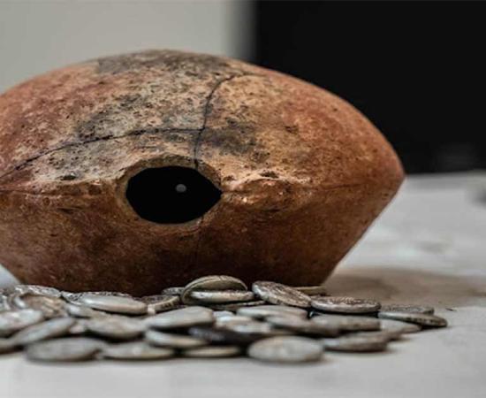 The 300-BC Mleiha silver coin hoard and the ancient jar it was found in. Source: Sharjah Archaeology Authority