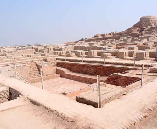 Excavated ruins of Mohenjo-daro, with the Great Bath in the foreground and the granary mound in the background