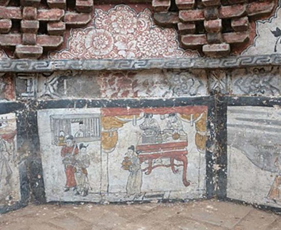The octagon-shaped tomb is filled with murals and has a pyramid-shaped roof.