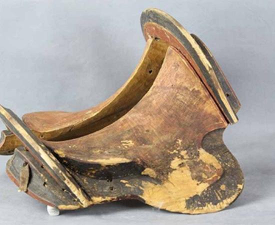 The oldest known wooden frame saddle from Urd Ulaan Uneet.	Source: Antiquity Publications Ltd
