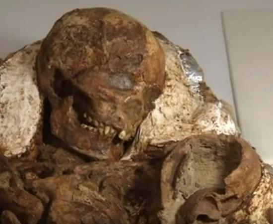 The Stone Age remains of a mother cradling her baby.
