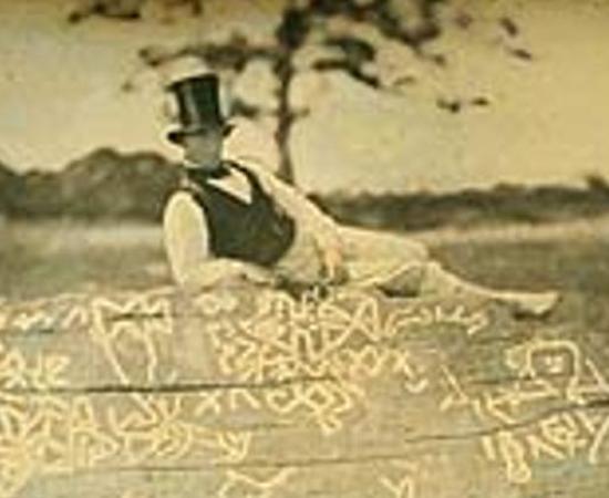An 1853 reversed image of Seth Eastman (known for documenting Native American life in the 1800s) on top of the boulder known as Dighton Rock.