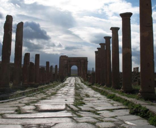 Roman Ruins of Timgad (Wilaya of Batna, Algeria). Street leading to the Arch of Trajan. 