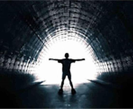 Deceased person entering the tunnel with the white light at the end that is so frequently reported during near-death experiences.