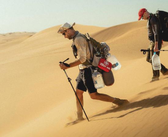 Professor Dominic Stratford and Dr George Leader, trekking the Namib desert.