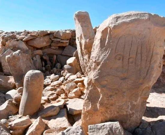 One of the ancient faces carved in stone at a remarkably well-preserved Neolithic shrine found at a prehistoric gazelle hunting camp in Jordan’s eastern desert.           Source: Jordan Tourism Ministry