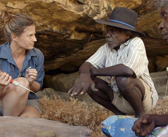 Researcher Elspeth Hayes with Mark Djandjomerr and traditional owner May Nango extracting comparative samples at a cave adjacent Madjedbebe. Credit: David Vadiveloo / Gundjeihmi Aboriginal Corporation