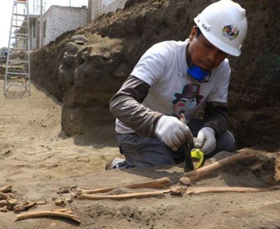Excavating one of the Pre-Inca tombs.