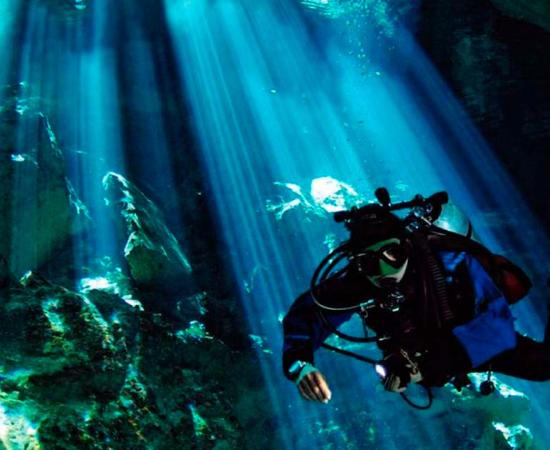 Diver in a cenote in Mexico. Public Domain.