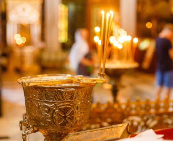 Chalice for olive oil in a religious setting.