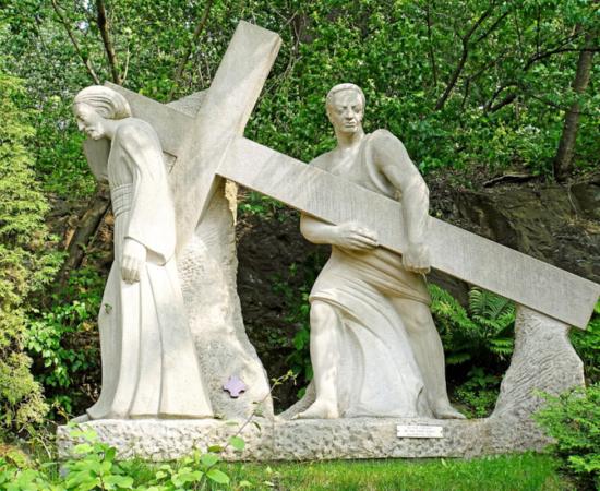 Fifth Station sculpture of Simon of Cyrene helping Jesus carry the cross. 