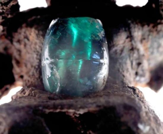 An emerald mounted on a copper pendant recovered from a Coclé burial. 