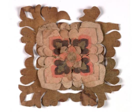 V&A collection image showing the group of nine paper flowers recovered from Cave 17, Mogao Caves. 