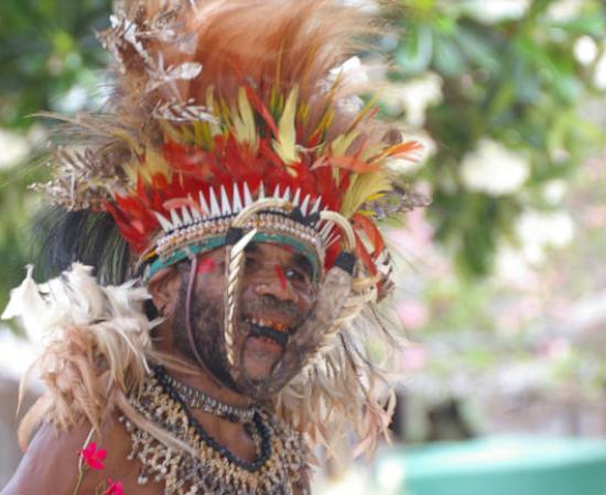 A Papua New Guinean wearing traditional wear.