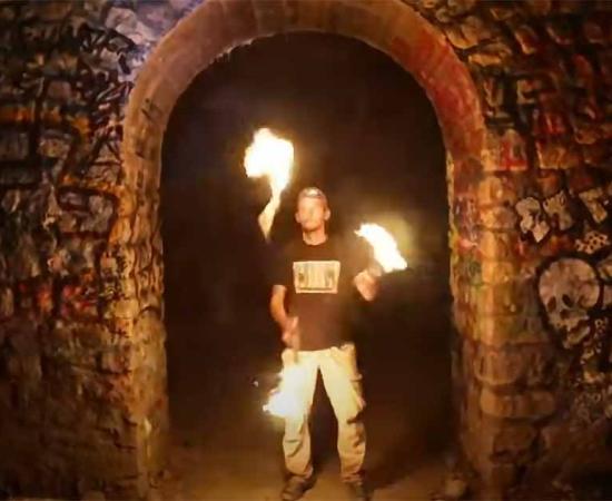 A ‘cataphile’ inside the Paris catacombs. Source: YouTube Screenshot / The New York Times.