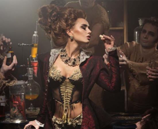 Representation of woman smelling a new perfume scent in an ancient perfumery lab.	Source: razoomanetu/Adobe Stock