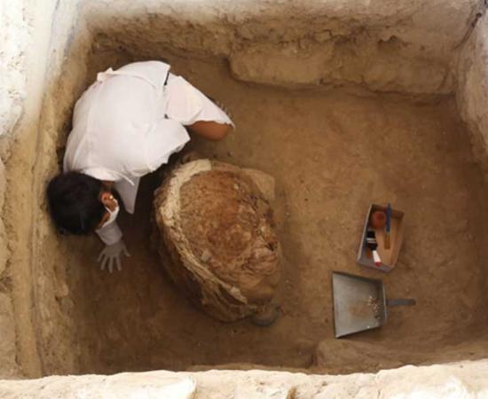 Archaeologist carrying out excavations at the pyramid of the bees.