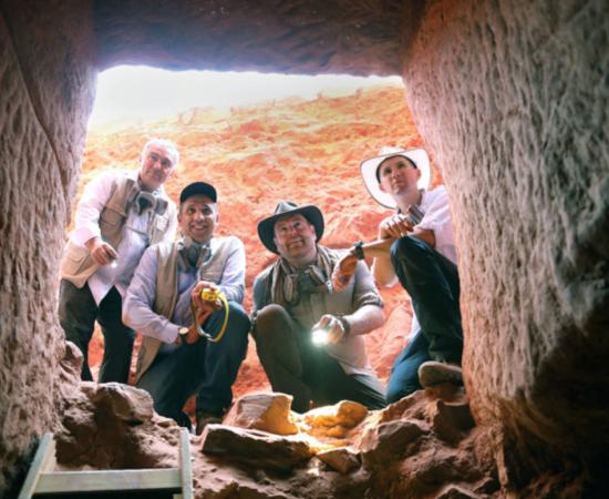Josh Gates and the team at the entrance of the tomb found at Petra.