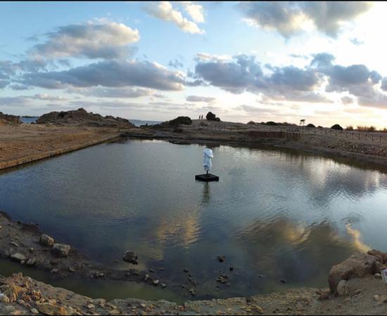 Protruding ledge M.4555 (see Figure 4), roughly at the mid-point of the northern side of the ‘Kothon’; viewed from the west.		Source: © Sapienza University of Rome Expedition to Motya / Antiquity Publications Ltd View of the refurbished ‘Kothon’ with a replica of the statue of Ba’al at its center (© Sapienza University of Rome Expedition to Motya / Antiquity Publications Ltd).