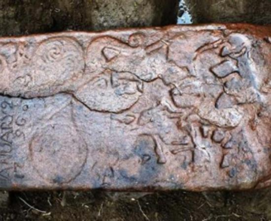 The Pictish stone was reused as a horizonal grave slab in the 1790s - hence the inscription in the corner. Source: NOSAS