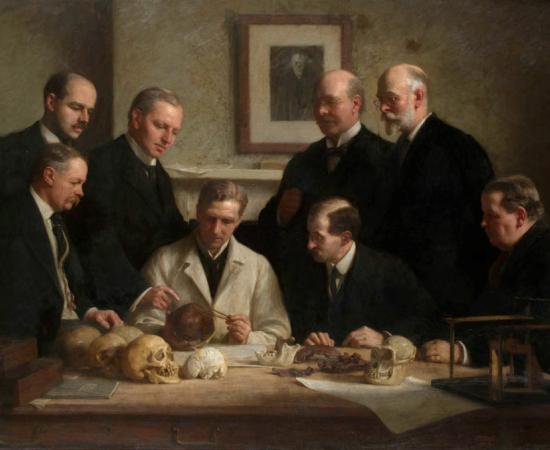 A portrait painted by John Cooke in 1915 showing scientists involved in the Piltdown man case: F. O. Barlow, G. Elliot Smith, Charles Dawson, Arthur Smith Woodward. Front row: A. S. Underwood, Arthur Keith, W. P. Pycraft, and Sir Ray Lankester.