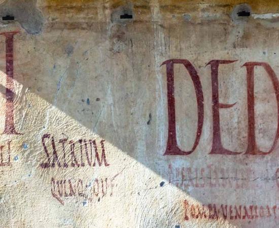 Pompeii graffiti. Source: Niklas / Adobe Stock.