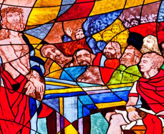 Stained glass image of Pontius Pilot condemning Jesus to death.