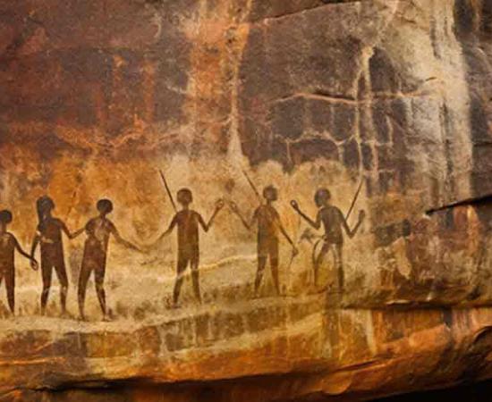 Rock art prehistoric aboriginal cave paintings of human silhouettes. Source: Jan/Adobe Stock