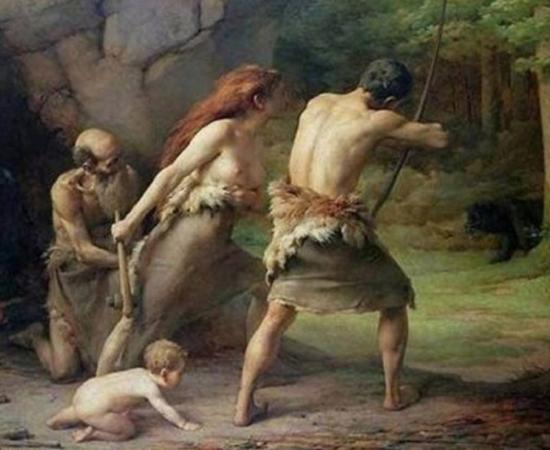 Prehistoric man and woman carrying weapons.